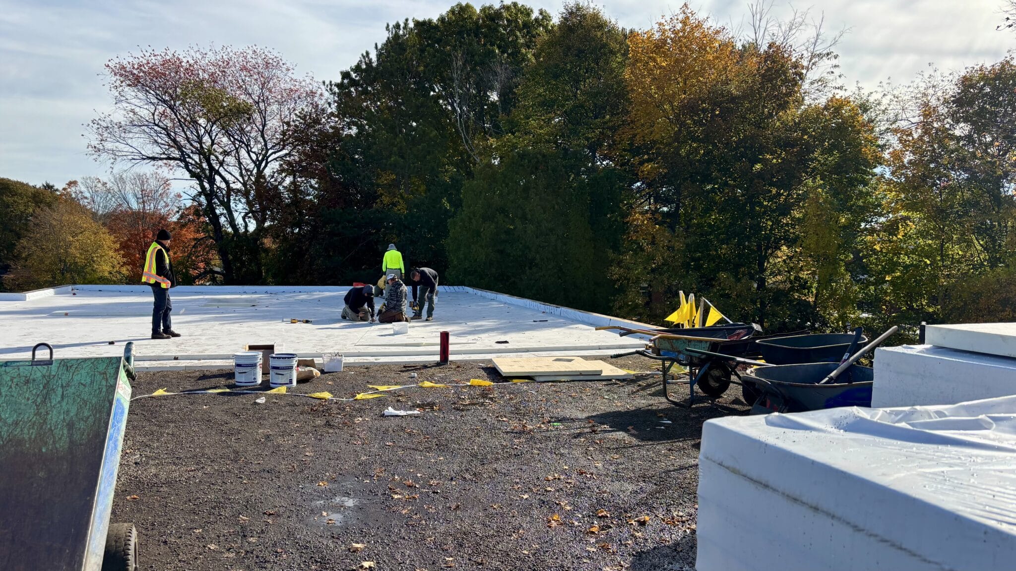Picture of workers beginning replacement of the Mary A. Alley Municipal building roof.